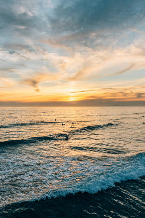 Waves in the Pacific Ocean at sunset, in Newport Beach, Orange County, Californiaの写真素材