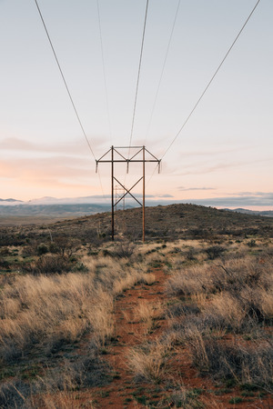 Power lines at sunset, in the desert of eastern Arizonaの写真素材