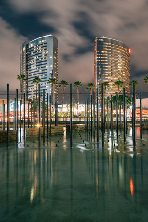 Modern buildings and pond at night, at Childrens Park, in downtown San Diego, Californiaの写真素材