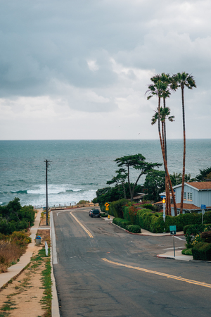 A street with view of the Pacific Ocean on a cloudy day, in Point Loma, San Diego, Californiaの写真素材