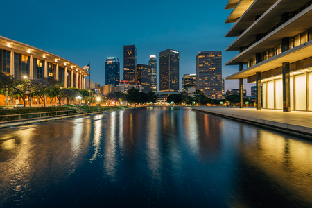 The downtown Los Angeles skyline at night, with the reflecting pool at the Department of Water and Power, in Los Angeles, Californiaのeditorial素材