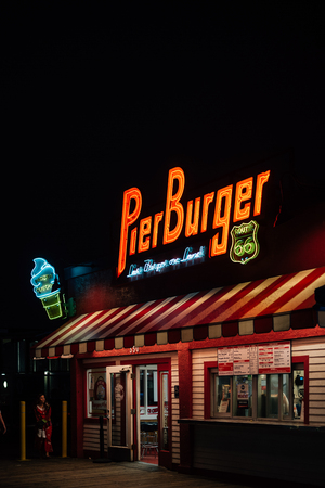 Pier Burger neon sign at night, on the Santa Monica Pier in Los Angeles, Californiaのeditorial素材