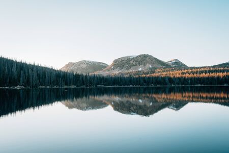 Mountains reflecting in Mirror Lake, in the Uinta Mountains, Utahの写真素材