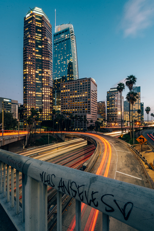 Cityscape skyline view of the 110 Freeway at night in downtown Los Angeles, Californiaのeditorial素材
