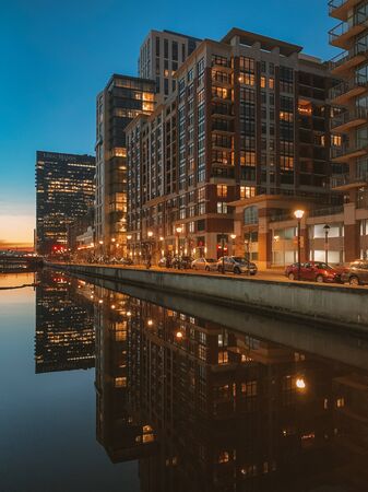 Cityscape view of Harbor East at night, in Baltimore, Maryland