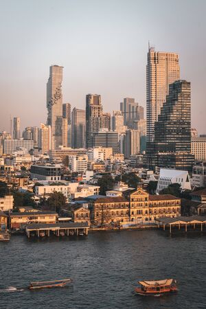 The Chao Phraya River and skyscrapers in Bangkok, Thailand