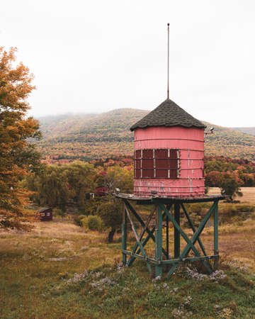 Small red water tower and autumn color, Catskill Mountains, New Yorkの写真素材