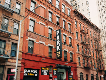 A brick building with a parking sign on it, East Village, New York, New Yorkのeditorial素材