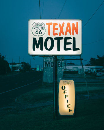 Texan Motel sign at night, on Route 66 in Shamrock, Texasの写真素材
