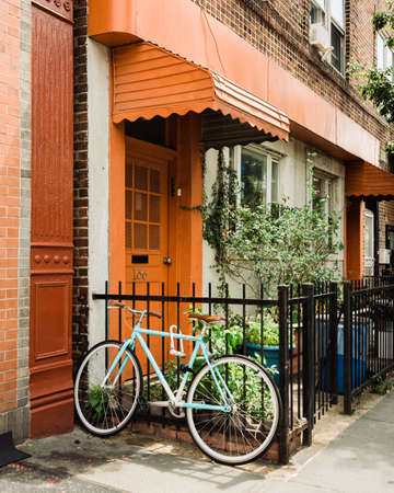 Bike and house with orange door in Greenpoint, Brooklyn, New York Cityの写真素材