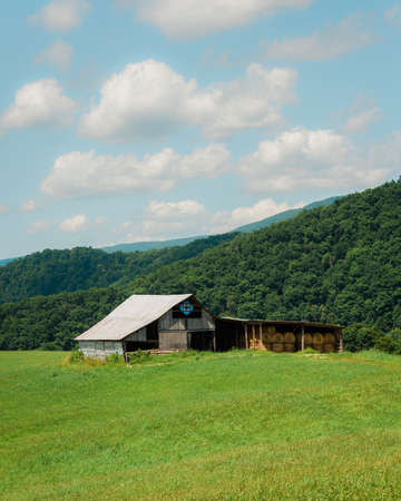 Rural scene with farm fields and barn in the mountains of West Virginiaの写真素材