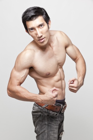 muscle man topless posingの写真素材
