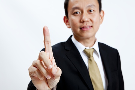 Businessman showing one finger isolated on white backgroundの写真素材