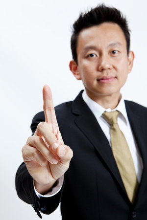 Businessman showing one finger isolated on white backgroundの写真素材