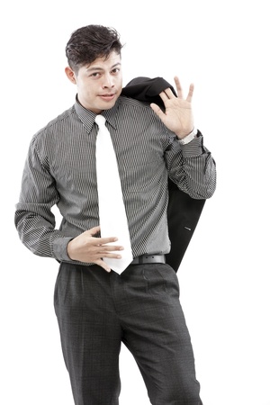 Businessman is having blazer behind and holding tie with another handの写真素材