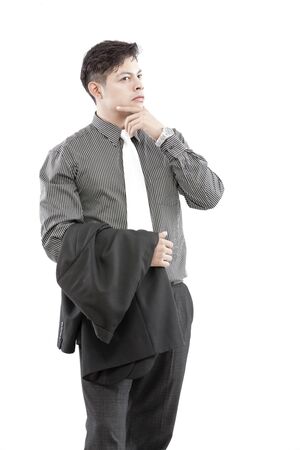 Businessman is having blazer on hand and another hand on chinの写真素材