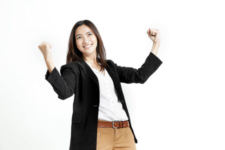 Young business woman posing with her fists isolated on white backgroundの写真素材
