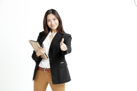 Young business woman holding a tablet computer isolated on white backgroundの写真素材