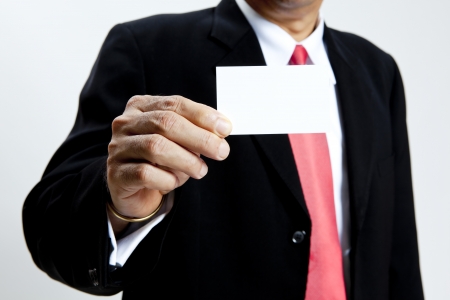 Mature businessman holding blank name cardの写真素材