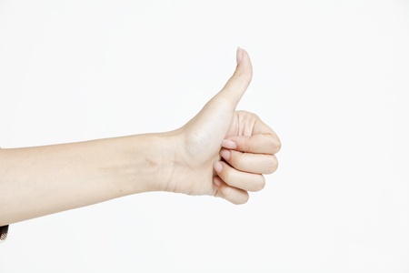 Female hand showing thumbs upの写真素材