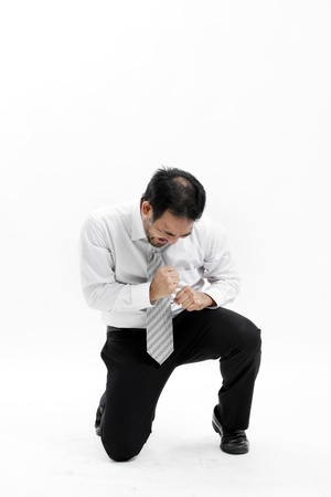 Businessman kneeling and celebrating successの写真素材