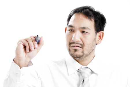Businessman with marker pen against white backgroundの写真素材