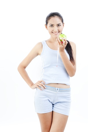 Beautiful asian lady holding a green apple の写真素材
