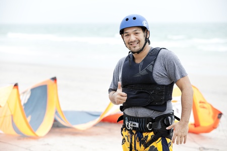 Man getting ready for kite surfingの写真素材