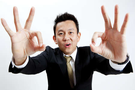 Businessman is showing hand gestureの写真素材