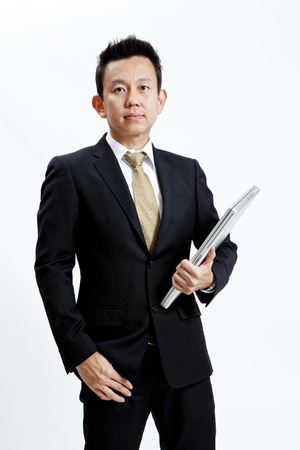 Businessman is holding his laptopの写真素材