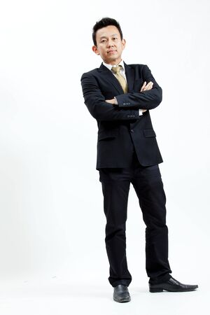 Businessman is standing with crossed armsの写真素材