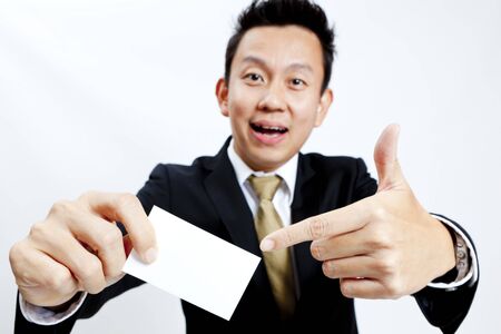 Businessman holding a blank business cardの写真素材