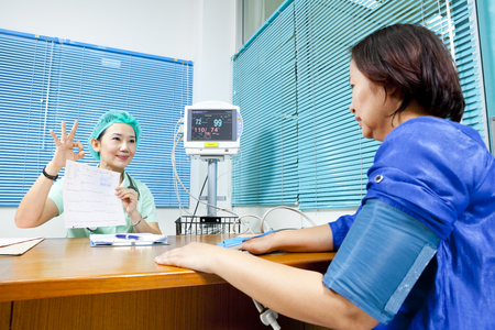 Healthcare professional showing health test resultsのeditorial素材