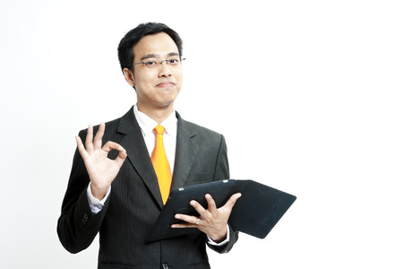 A businessman giving an okay signの写真素材