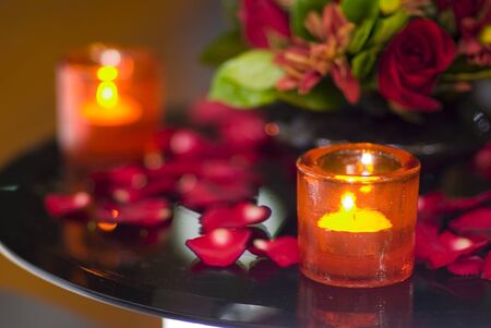 Close up of candles in orange glass casingsの写真素材