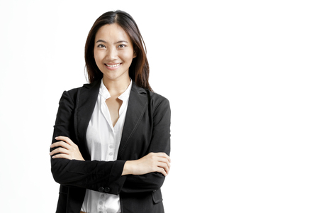 Pretty Asian woman with folded arms smilingの写真素材