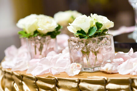 White roses in small vasesの写真素材