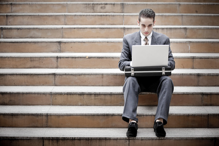 A businessman typing on his laptopの写真素材