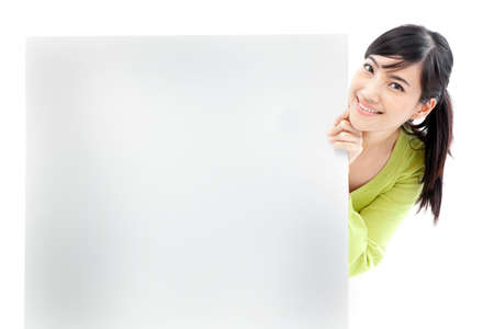 Young woman holding a blank white boardの写真素材