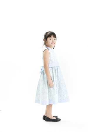 Girl posing in a floral dress の写真素材