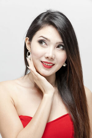 Asian woman wearing a red dressの写真素材
