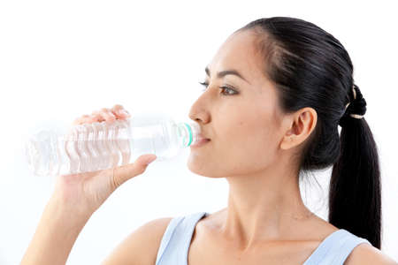 Asian woman with a bottle of waterの写真素材