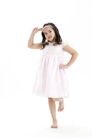 Girl posing in a white dressの写真素材