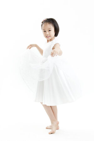 Girl posing in a white dressの写真素材