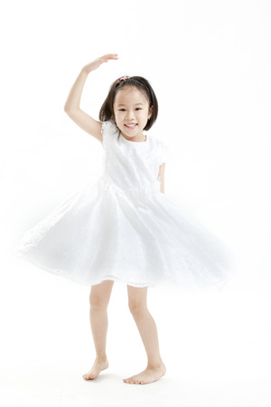 Girl posing in a white dressの写真素材