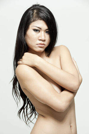 Asian woman posing toplessの写真素材