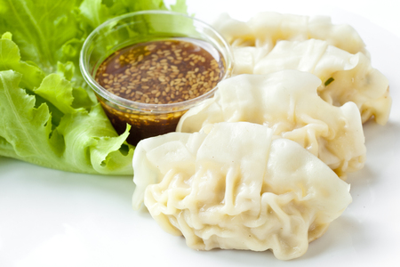 Dumplings with vegetables and sesame sauceの写真素材