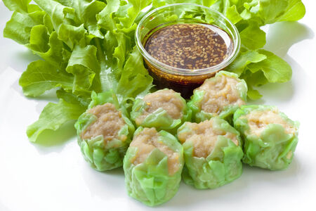 Dim sum with vegetables and sesame sauceの写真素材