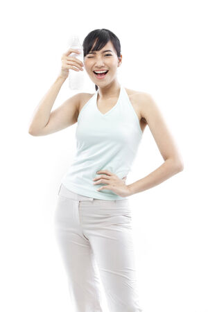 Young woman holding a bottle of waterの写真素材