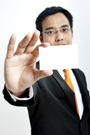 Businessman showing a blank cardの写真素材